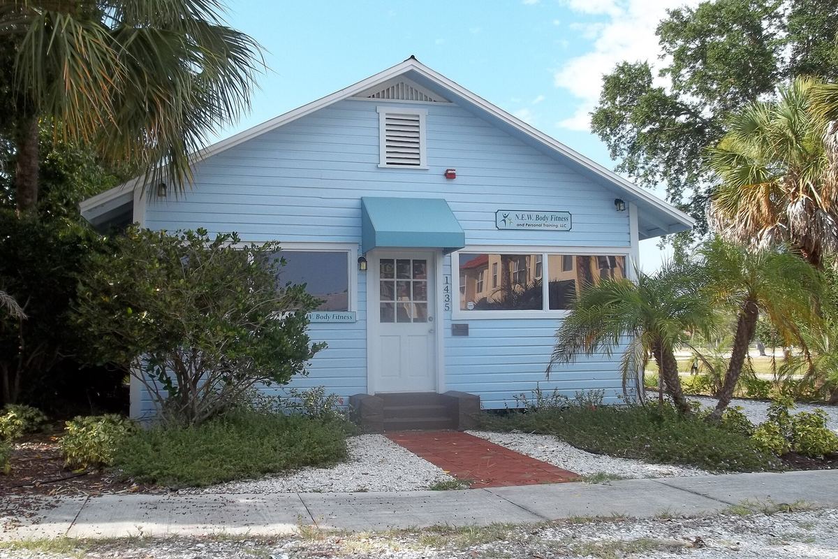 The historic Leonard Reid House, a pale blue cottage, at its original Overtown location in 2011
